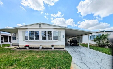 Move-in ready and fully furnished, this beautifully maintained on Grasslands Golf and Country Club in Florida - for sale on GolfHomes.com, golf home, golf lot
