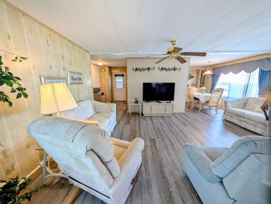 Move-in ready and fully furnished, this beautifully maintained on Grasslands Golf and Country Club in Florida - for sale on GolfHomes.com, golf home, golf lot