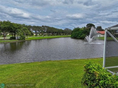 This home boasts the most magnificent view in Boca Greens! The on Boca Greens Country Club in Florida - for sale on GolfHomes.com, golf home, golf lot