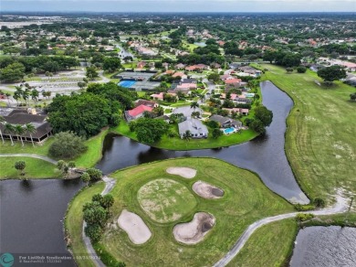 This home boasts the most magnificent view in Boca Greens! The on Boca Greens Country Club in Florida - for sale on GolfHomes.com, golf home, golf lot