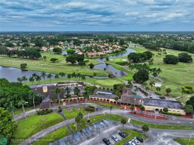 This home boasts the most magnificent view in Boca Greens! The on Boca Greens Country Club in Florida - for sale on GolfHomes.com, golf home, golf lot