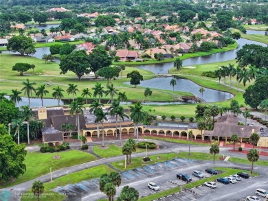 This home boasts the most magnificent view in Boca Greens! The on Boca Greens Country Club in Florida - for sale on GolfHomes.com, golf home, golf lot