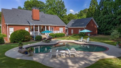 Welcome to this stunning all-brick ranch nestled in a desirable on Monroe Golf and Country Club in Georgia - for sale on GolfHomes.com, golf home, golf lot