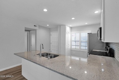 Welcome home to effortless living in Fountain of the Sun, a on Fountain of the Sun Country Club in Arizona - for sale on GolfHomes.com, golf home, golf lot