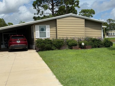 This lovely, manufacture home is on leased land in Lake Fairways on Pine Lakes Country Club in Florida - for sale on GolfHomes.com, golf home, golf lot
