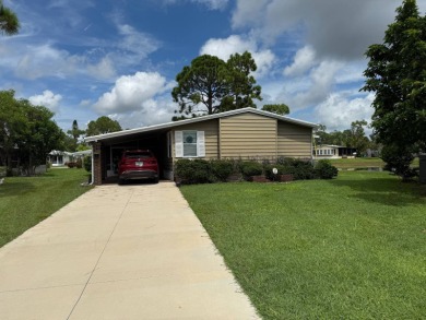 This lovely, manufacture home is on leased land in Lake Fairways on Pine Lakes Country Club in Florida - for sale on GolfHomes.com, golf home, golf lot