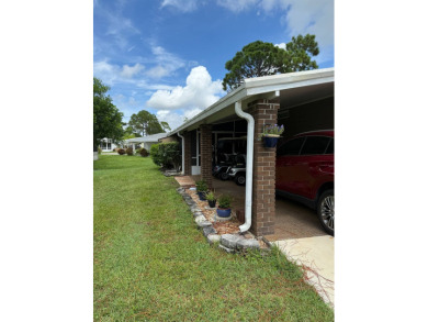 This lovely, manufacture home is on leased land in Lake Fairways on Pine Lakes Country Club in Florida - for sale on GolfHomes.com, golf home, golf lot