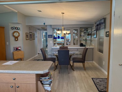 This lovely, manufacture home is on leased land in Lake Fairways on Pine Lakes Country Club in Florida - for sale on GolfHomes.com, golf home, golf lot