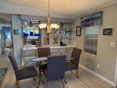 This lovely, manufacture home is on leased land in Lake Fairways on Pine Lakes Country Club in Florida - for sale on GolfHomes.com, golf home, golf lot