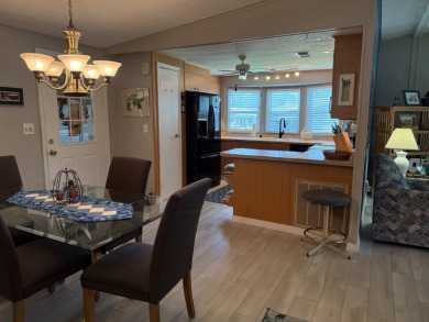 This lovely, manufacture home is on leased land in Lake Fairways on Pine Lakes Country Club in Florida - for sale on GolfHomes.com, golf home, golf lot