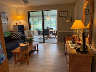 This lovely, manufacture home is on leased land in Lake Fairways on Pine Lakes Country Club in Florida - for sale on GolfHomes.com, golf home, golf lot