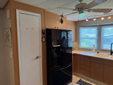 This lovely, manufacture home is on leased land in Lake Fairways on Pine Lakes Country Club in Florida - for sale on GolfHomes.com, golf home, golf lot
