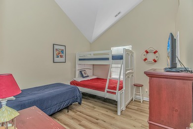 This LAKE FRONT 5 bedroom 3.5  bath raised beach house with on Prestwick Country Club in South Carolina - for sale on GolfHomes.com, golf home, golf lot