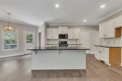 Spacious home nestled in the sought-after Bridgemill community on Bridgemill Golf Club in Georgia - for sale on GolfHomes.com, golf home, golf lot