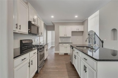 Spacious home nestled in the sought-after Bridgemill community on Bridgemill Golf Club in Georgia - for sale on GolfHomes.com, golf home, golf lot