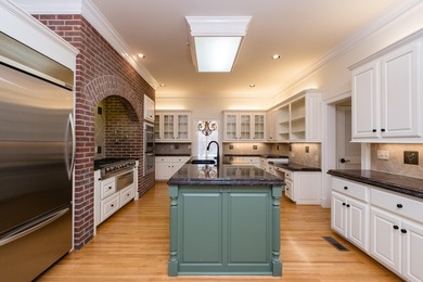 This beautiful CUSTOM home on the prestigious Founder's Course on Chenal Country Club - Bear Den Mountain in Arkansas - for sale on GolfHomes.com, golf home, golf lot