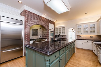 This beautiful CUSTOM home on the prestigious Founder's Course on Chenal Country Club - Bear Den Mountain in Arkansas - for sale on GolfHomes.com, golf home, golf lot