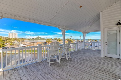 This LAKE FRONT 5 bedroom 3.5  bath raised beach house with on Prestwick Country Club in South Carolina - for sale on GolfHomes.com, golf home, golf lot