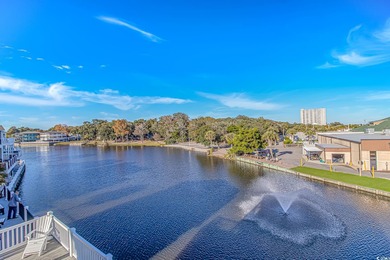 This LAKE FRONT 5 bedroom 3.5  bath raised beach house with on Prestwick Country Club in South Carolina - for sale on GolfHomes.com, golf home, golf lot