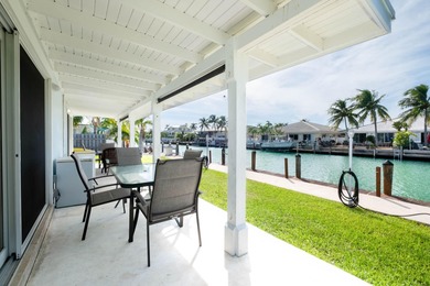 A rare opportunity to own a beautifully maintained piece of on Key Colony Beach Golf Course in Florida - for sale on GolfHomes.com, golf home, golf lot