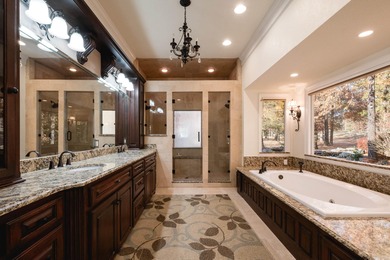 This beautiful CUSTOM home on the prestigious Founder's Course on Chenal Country Club - Bear Den Mountain in Arkansas - for sale on GolfHomes.com, golf home, golf lot