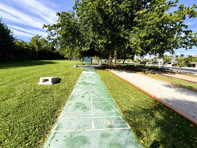 A rare opportunity to own a beautifully maintained piece of on Key Colony Beach Golf Course in Florida - for sale on GolfHomes.com, golf home, golf lot