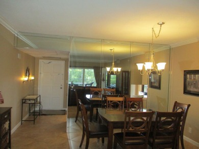 Welcome to this beautifully furnished upgraded 2-bedroom on Palm-Aire Country Club and Resort - Palms in Florida - for sale on GolfHomes.com, golf home, golf lot
