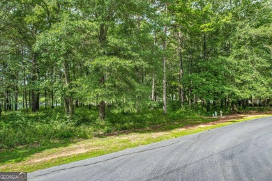 Located in the prestigious Great Waters neighborhood of Reynolds on Great Waters Course At Reynolds Plantation in Georgia - for sale on GolfHomes.com, golf home, golf lot