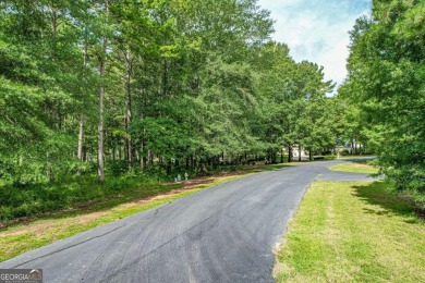 Located in the prestigious Great Waters neighborhood of Reynolds on Great Waters Course At Reynolds Plantation in Georgia - for sale on GolfHomes.com, golf home, golf lot