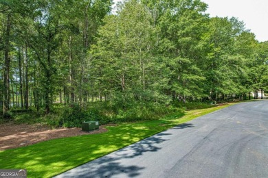 Located in the prestigious Great Waters neighborhood of Reynolds on Great Waters Course At Reynolds Plantation in Georgia - for sale on GolfHomes.com, golf home, golf lot