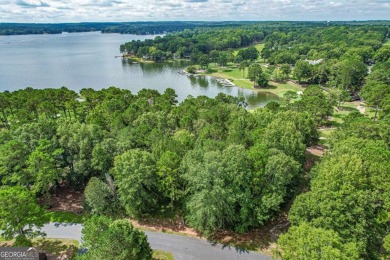 Located in the prestigious Great Waters neighborhood of Reynolds on Great Waters Course At Reynolds Plantation in Georgia - for sale on GolfHomes.com, golf home, golf lot