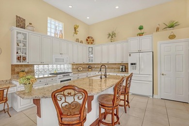 Wake up to tranquil water and fairway views in this light-filled on  in Florida - for sale on GolfHomes.com, golf home, golf lot