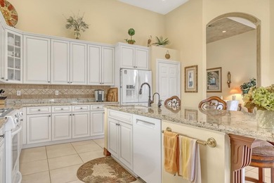 Wake up to tranquil water and fairway views in this light-filled on  in Florida - for sale on GolfHomes.com, golf home, golf lot