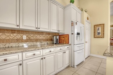 Wake up to tranquil water and fairway views in this light-filled on  in Florida - for sale on GolfHomes.com, golf home, golf lot