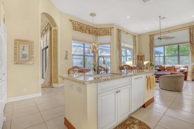 Wake up to tranquil water and fairway views in this light-filled on  in Florida - for sale on GolfHomes.com, golf home, golf lot