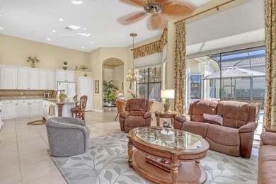 Wake up to tranquil water and fairway views in this light-filled on  in Florida - for sale on GolfHomes.com, golf home, golf lot
