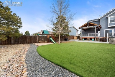 This lovely, spacious Woodmen Hill home awaits you.  Great curb on Antler Creek Golf Course in Colorado - for sale on GolfHomes.com, golf home, golf lot