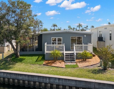 Show stopper! This totally remodeled rare 3 bedroom/2 bath on Mangrove Bay Golf Course in Florida - for sale on GolfHomes.com, golf home, golf lot