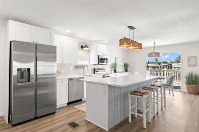 Show stopper! This totally remodeled rare 3 bedroom/2 bath on Mangrove Bay Golf Course in Florida - for sale on GolfHomes.com, golf home, golf lot