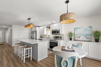 Show stopper! This totally remodeled rare 3 bedroom/2 bath on Mangrove Bay Golf Course in Florida - for sale on GolfHomes.com, golf home, golf lot