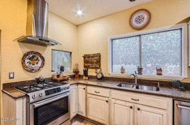 Nestled within the gated active-adult community of Oakwood at on Oakwood Golf Club  in Arizona - for sale on GolfHomes.com, golf home, golf lot