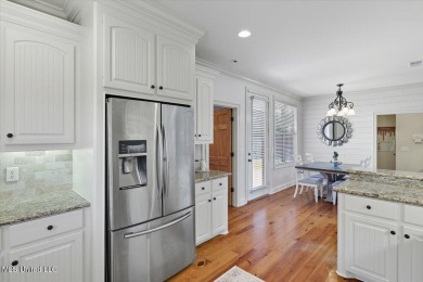 Welcome home to this charming 3-bedroom, 2-bath residence in the on Lake Caroline Golf Club in Mississippi - for sale on GolfHomes.com, golf home, golf lot