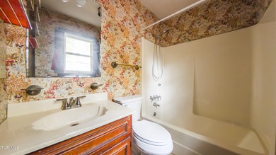 This spacious 4-bedroom, 3-bath home offers incredible potential on Country Club of Bristol in Tennessee - for sale on GolfHomes.com, golf home, golf lot
