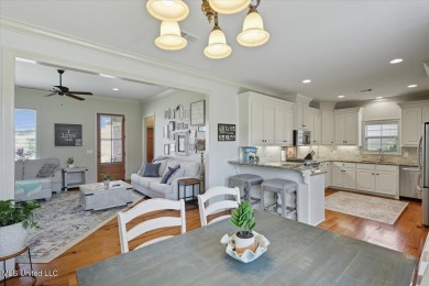 Welcome home to this charming 3-bedroom, 2-bath residence in the on Lake Caroline Golf Club in Mississippi - for sale on GolfHomes.com, golf home, golf lot