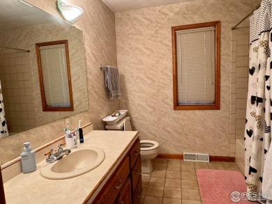 Surrounded by 40 trees, and nestled in a spacious, desirable on Pawnee Pines Golf Club in Colorado - for sale on GolfHomes.com, golf home, golf lot