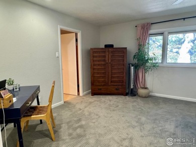 Surrounded by 40 trees, and nestled in a spacious, desirable on Pawnee Pines Golf Club in Colorado - for sale on GolfHomes.com, golf home, golf lot