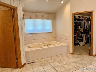 Surrounded by 40 trees, and nestled in a spacious, desirable on Pawnee Pines Golf Club in Colorado - for sale on GolfHomes.com, golf home, golf lot