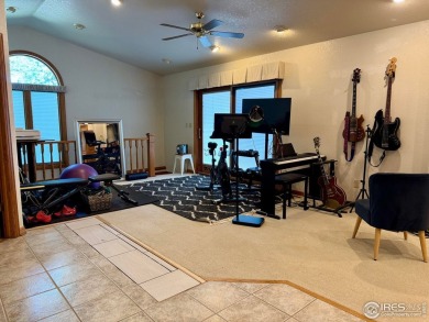 Surrounded by 40 trees, and nestled in a spacious, desirable on Pawnee Pines Golf Club in Colorado - for sale on GolfHomes.com, golf home, golf lot
