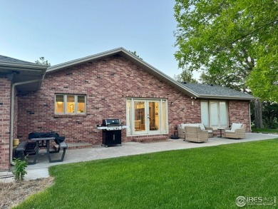 Surrounded by 40 trees, and nestled in a spacious, desirable on Pawnee Pines Golf Club in Colorado - for sale on GolfHomes.com, golf home, golf lot