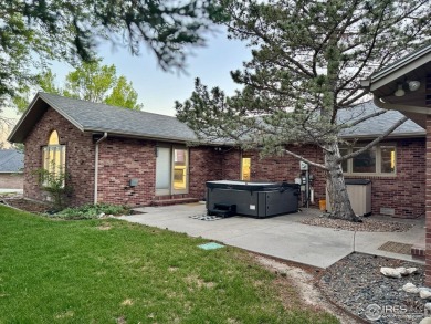 Surrounded by 40 trees, and nestled in a spacious, desirable on Pawnee Pines Golf Club in Colorado - for sale on GolfHomes.com, golf home, golf lot